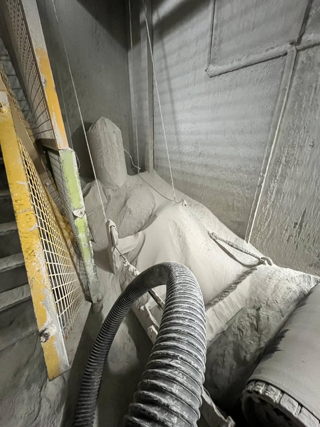 Vacuum excavation hose inside an underground service duct during a clearing job