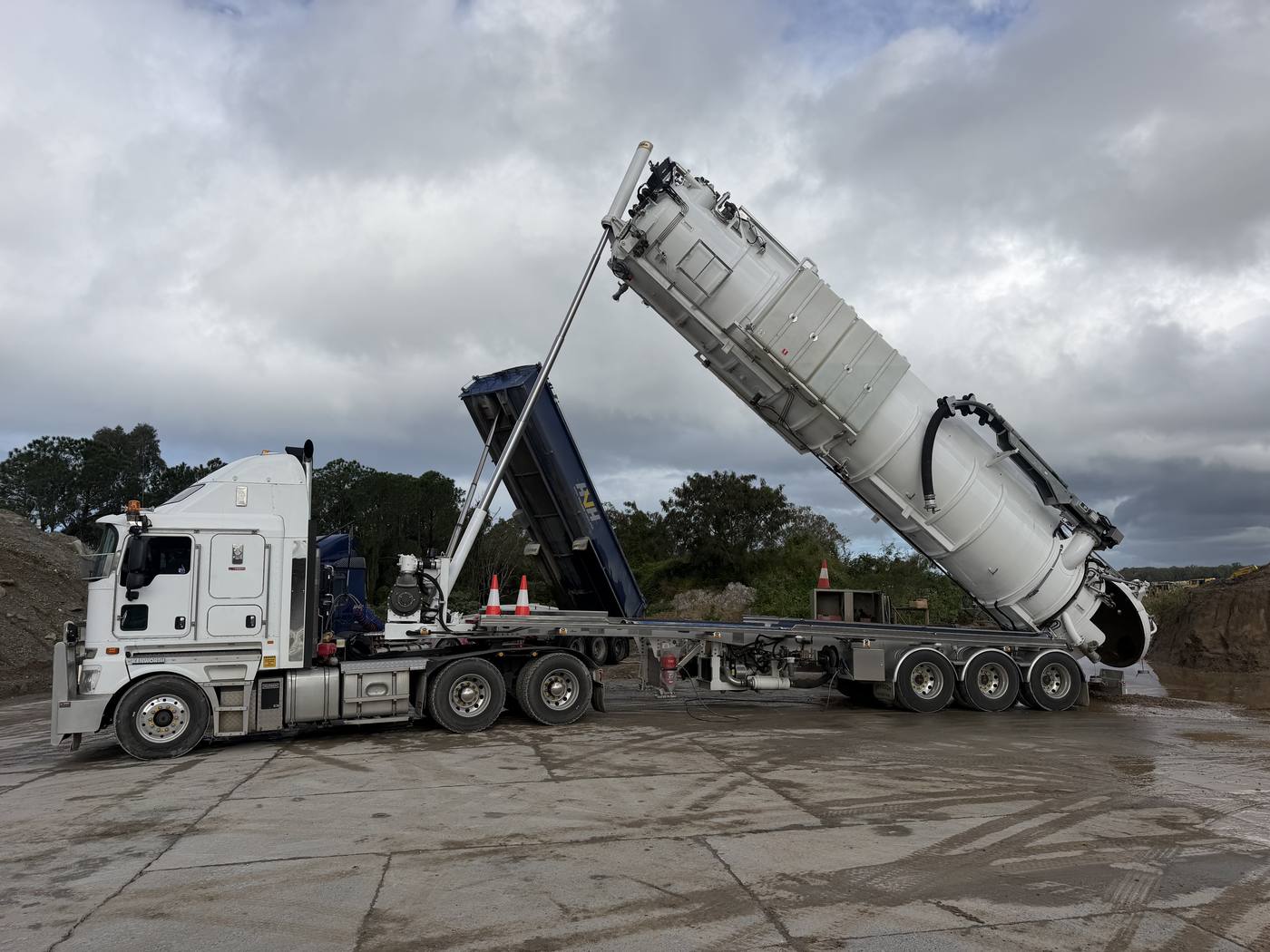 KVAC vacuum excavation truck tipping and emptying spoil at a disposal site