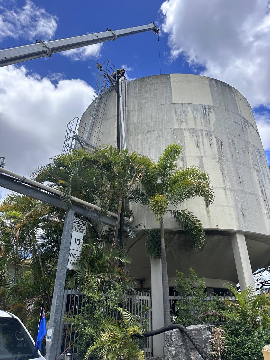 KVAC crew working at height on a large concrete water reservoir tank